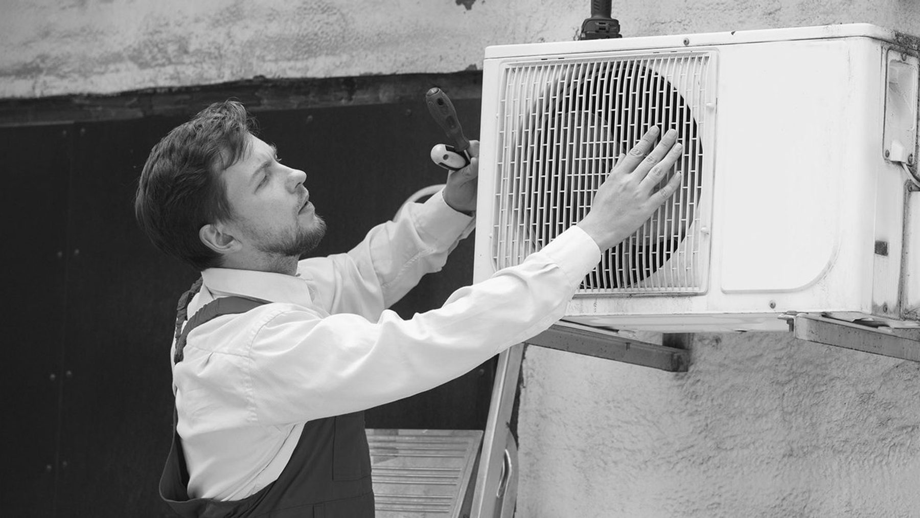 A close view of an air conditioning electrical disconnect and wiring.