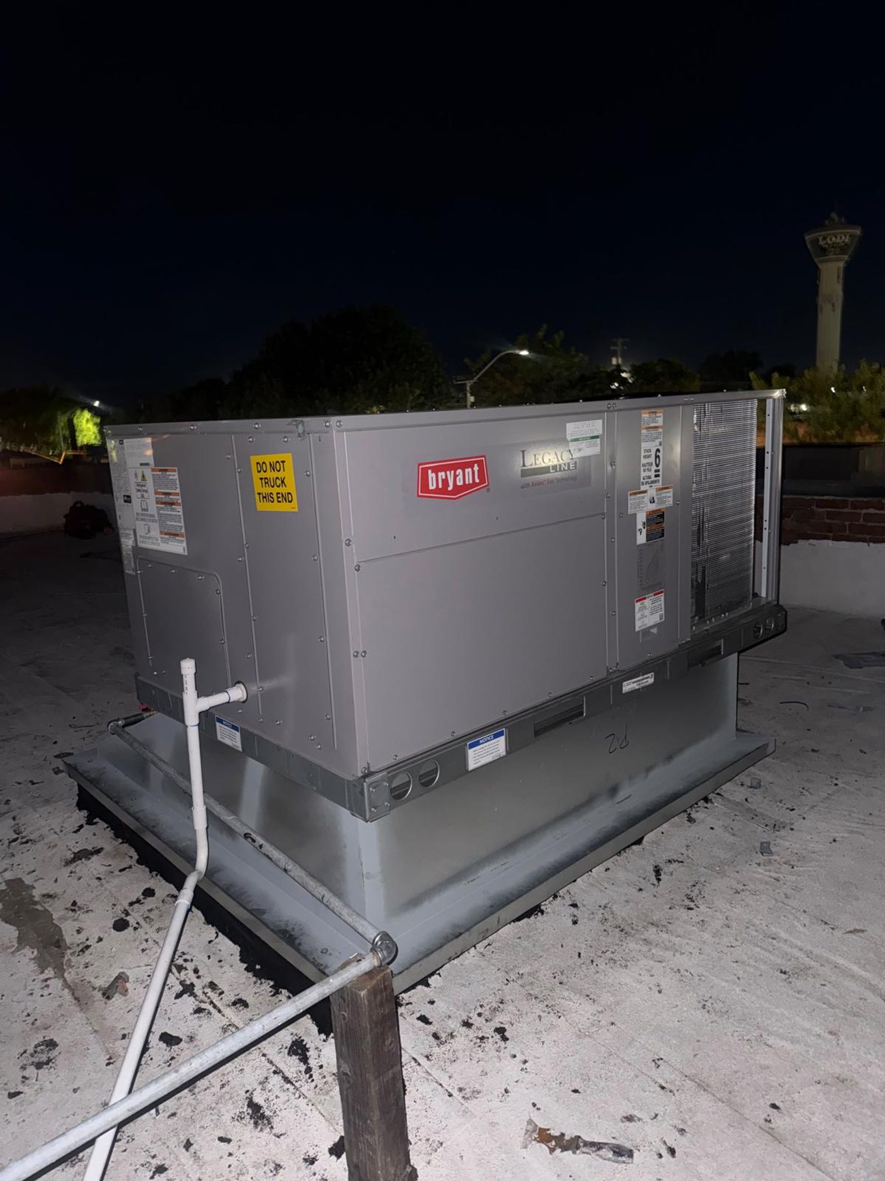 A Bryant Legacy Line rooftop air conditioning unit on a commercial building roof in Stockton, California.