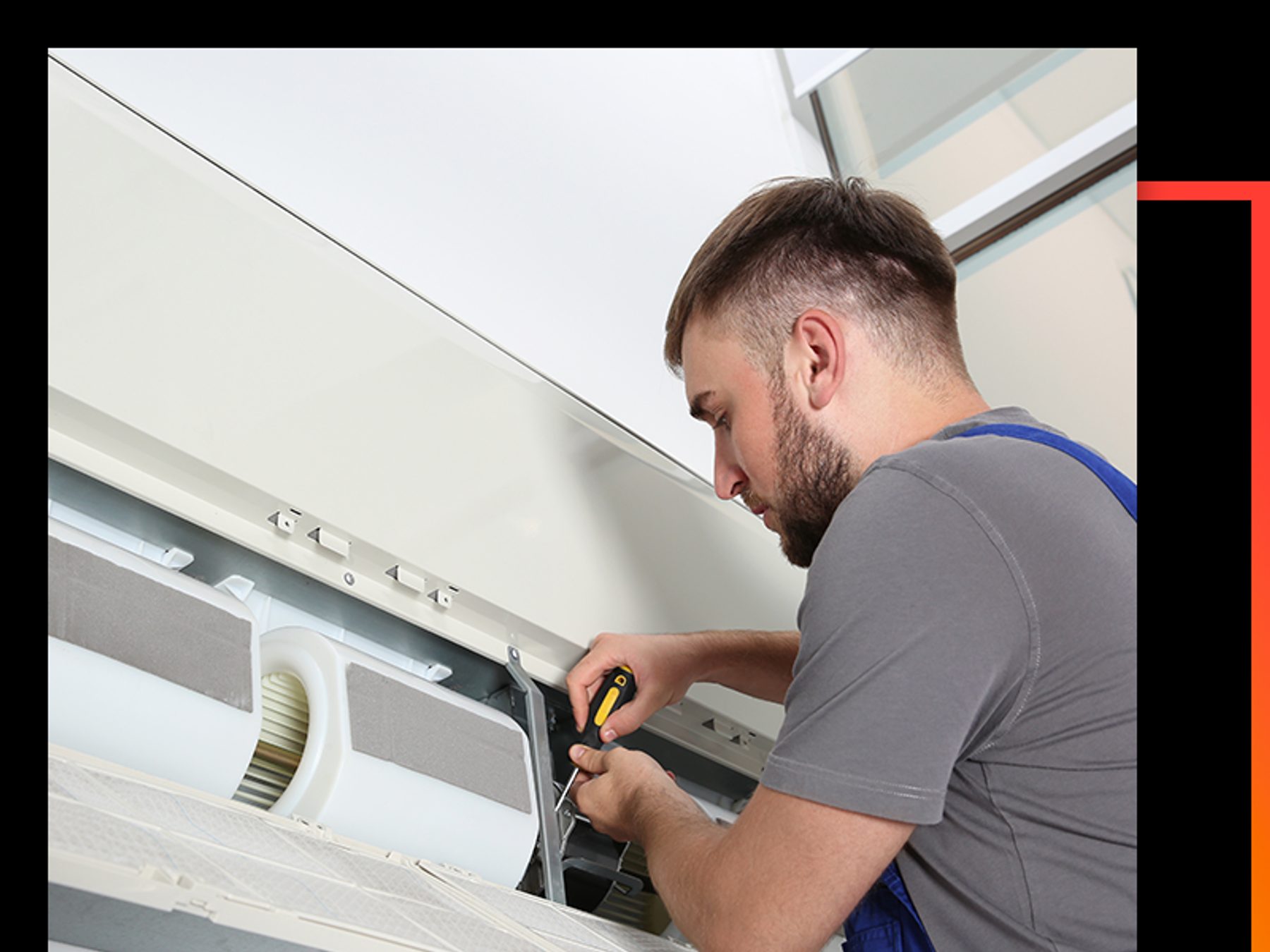 A technician working on a residential air conditioning system.